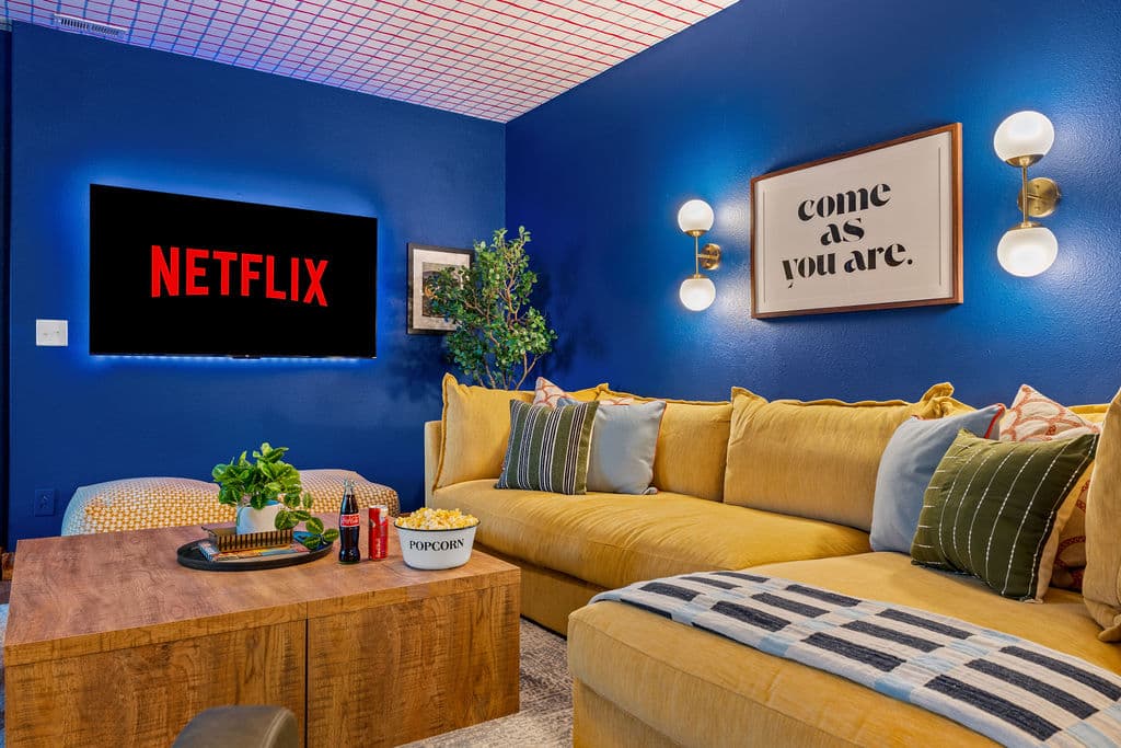 Sink into the sectional and pull up a movie — the game room TV is made for whole-group watching