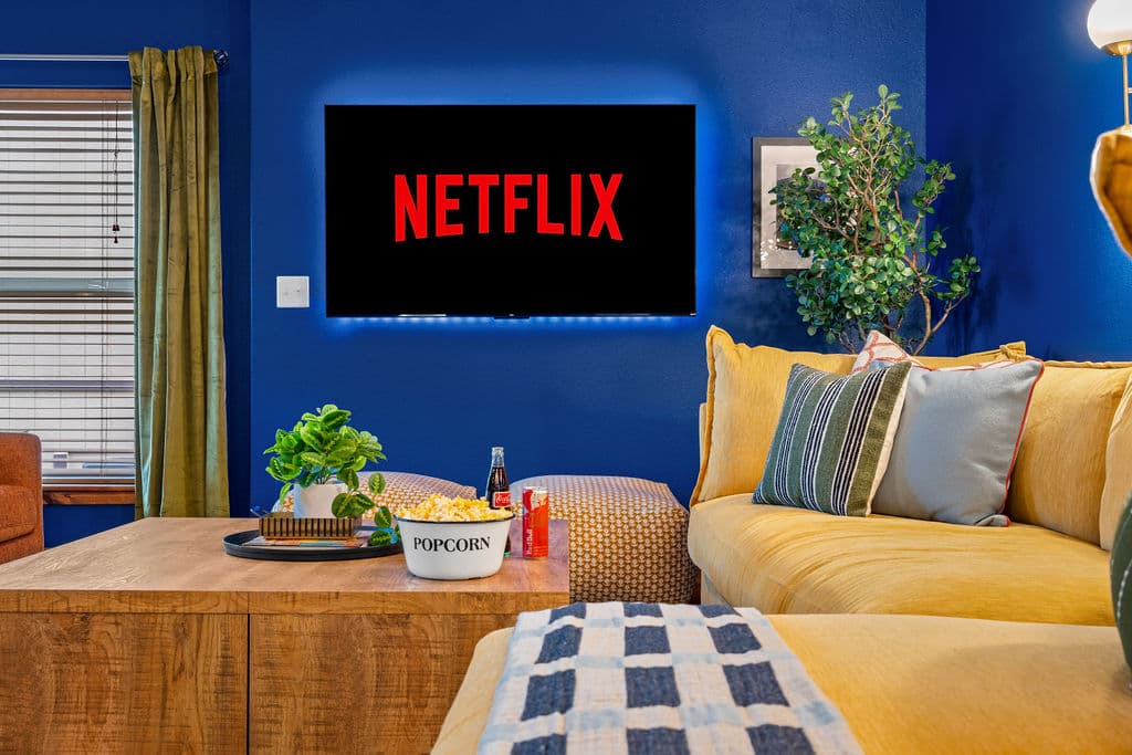 Cozy up and stream your favorites — the game room TV is built for the whole crew