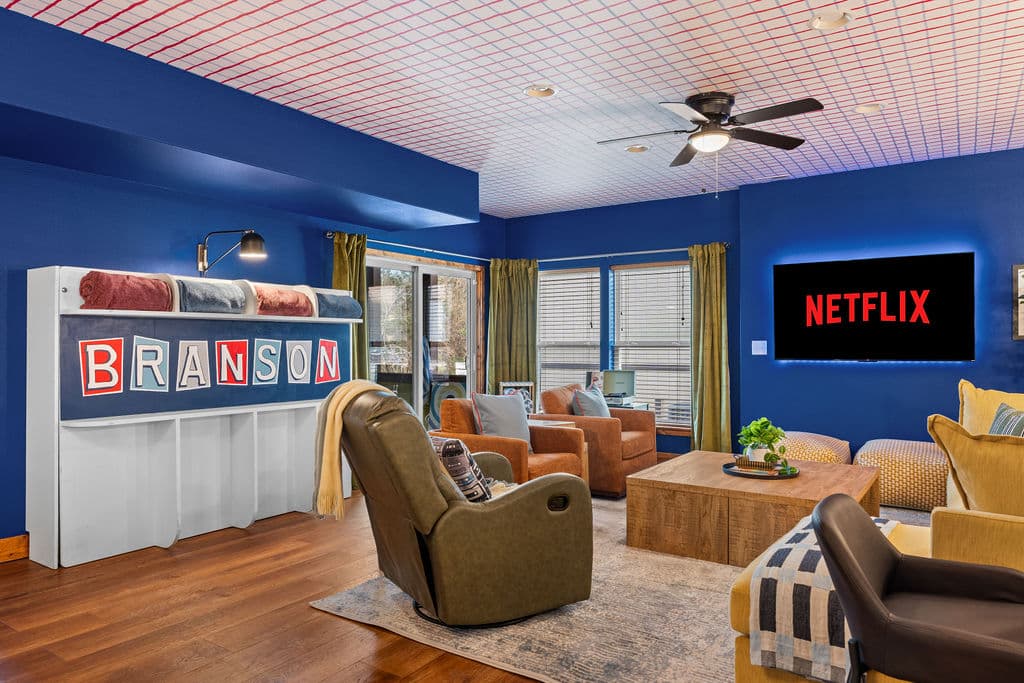 The Murphy bed converts the game room into a 7th sleeping space — and there's still room for the rocker