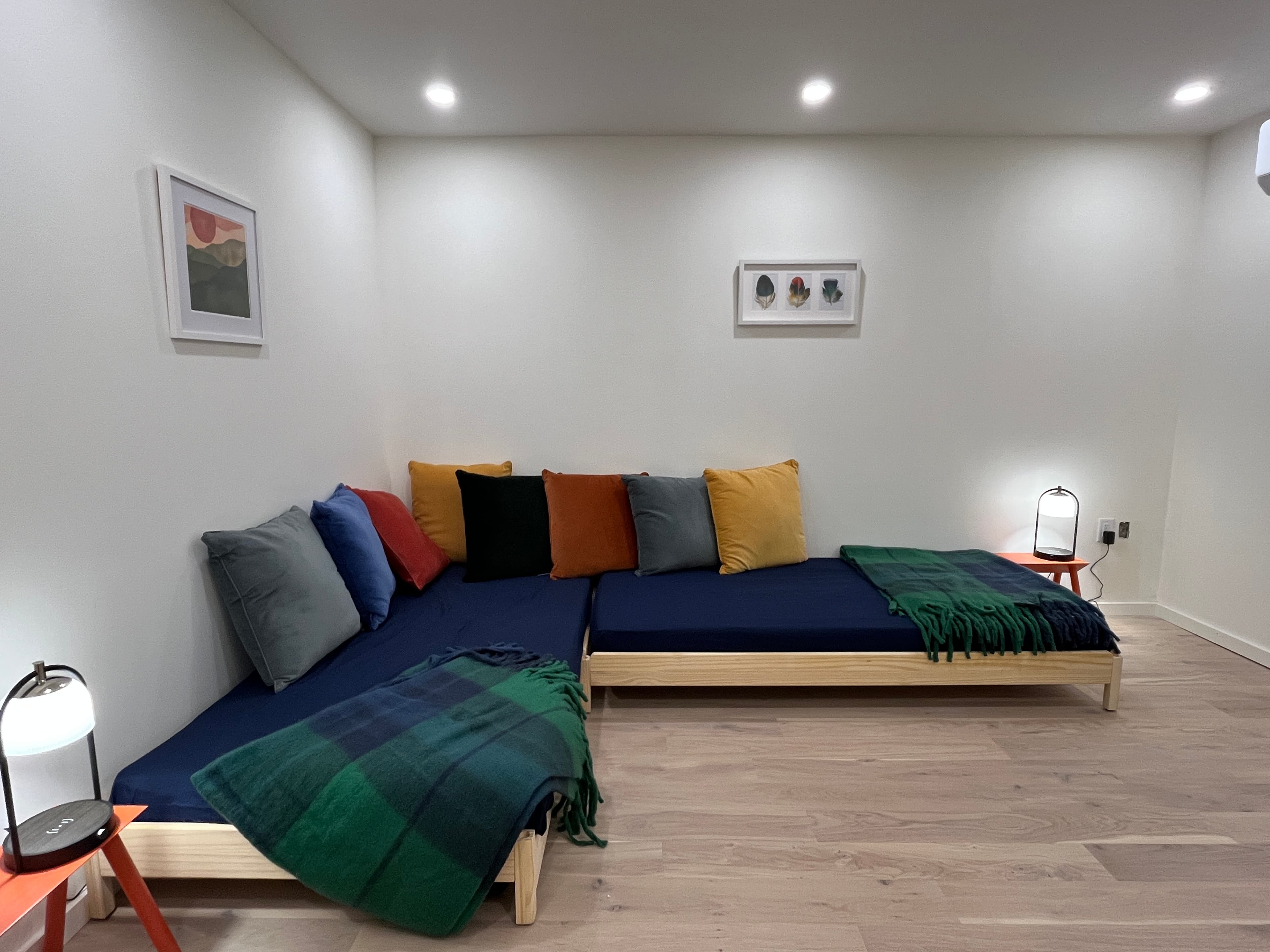 The daybeds in the office can also combine to form a proper King bed.