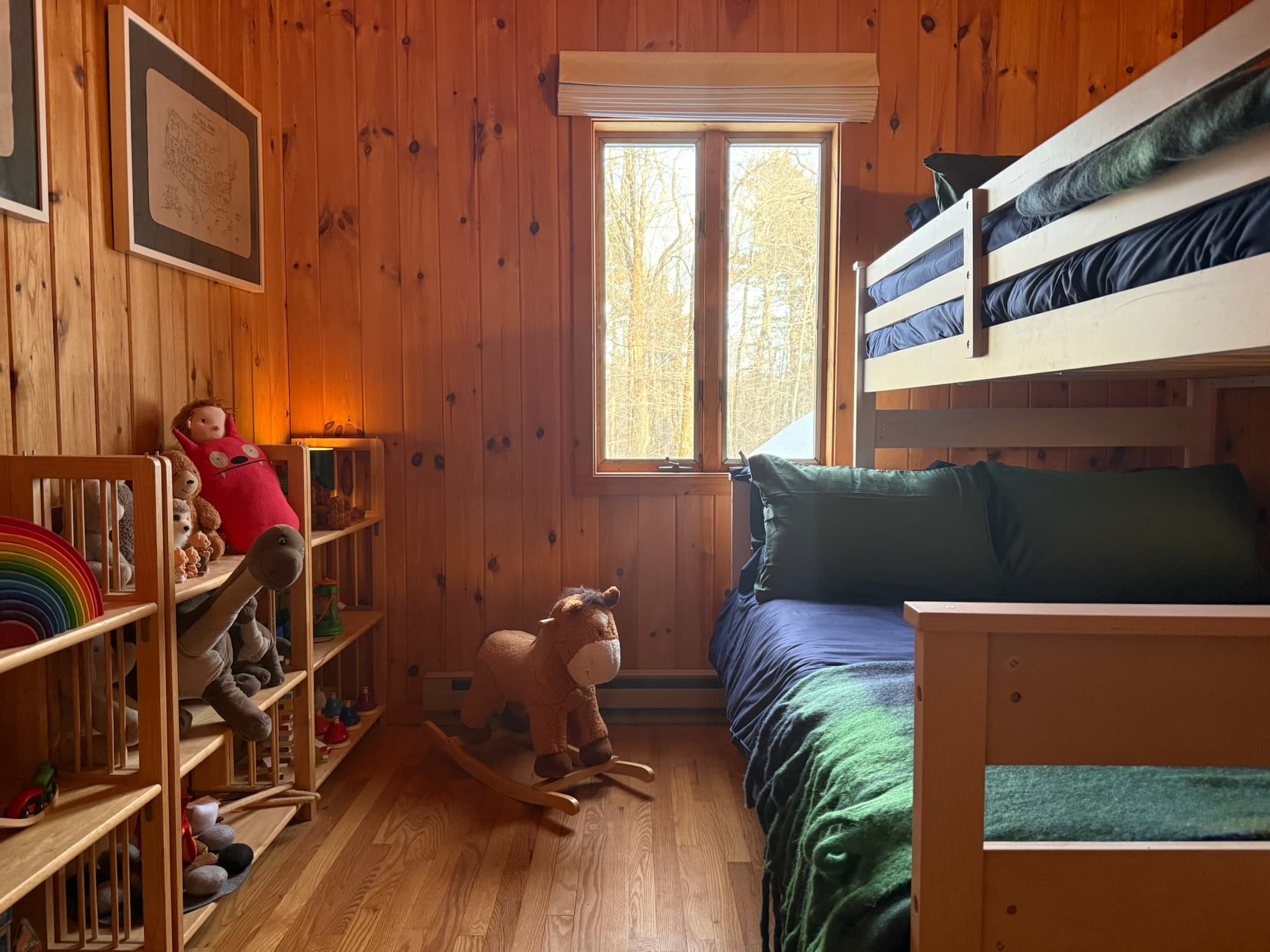 The bunk room has everything to make the kids feel at home with plenty of toys, books, and stuffies.