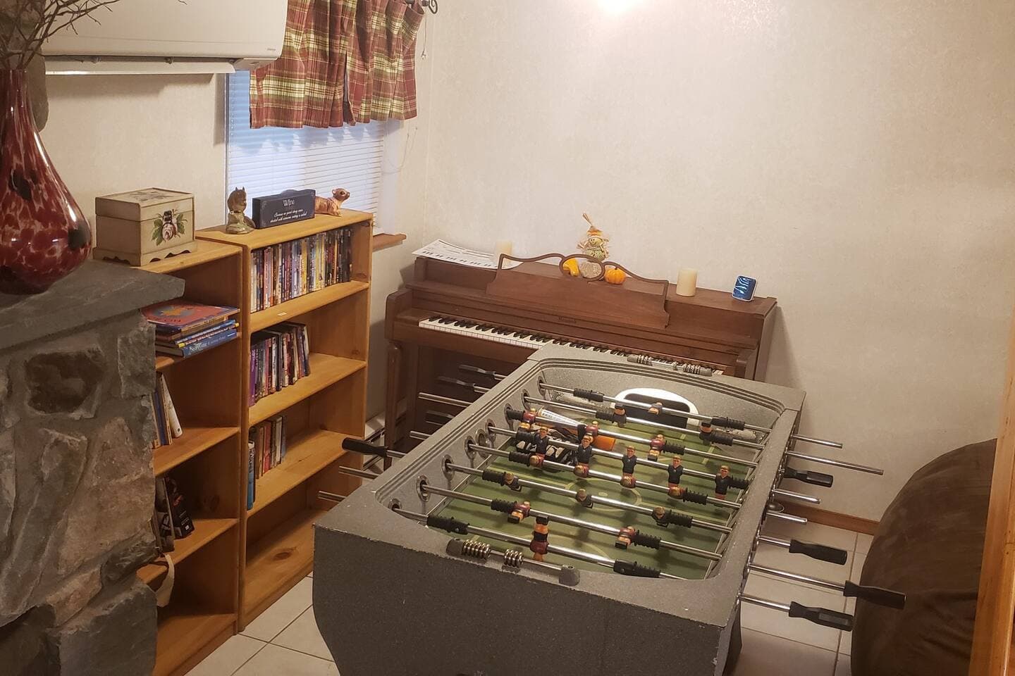 Media/Game corner in the den. Books of all kinds, DVDs of all genres, Piano, Foosball, and love sac to chill on! Plenty to do if you just want to stay in on cold days. 