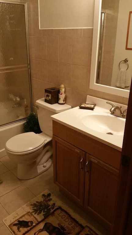 Full bathrooms have large sinks, extra storage, full tubs, showers, with fancy shower heads. Each bathroom sink contains a first aid kit, extra toilet paper, and a hair dryer.