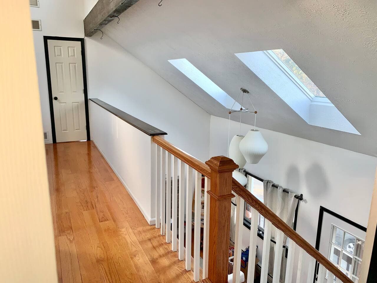 At the top of the stairs you are greeted to vaulted ceilings that seem to have no end! But now you have access to two more bedrooms. 