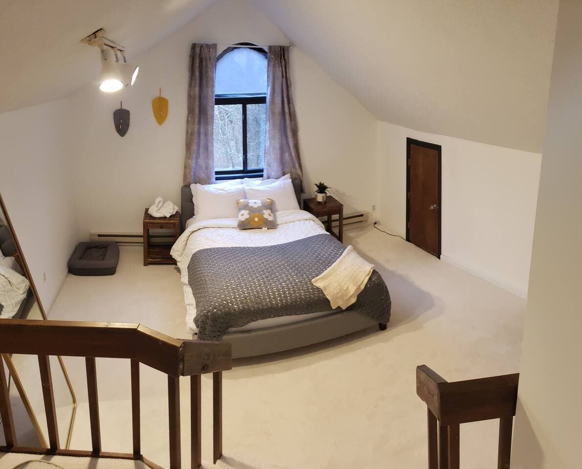 This bedroom was dubbed the "Hobbit Room" because of its low entryway & triangulated ceiling. Meaning if you are tall you have to duck to get into through the door. 