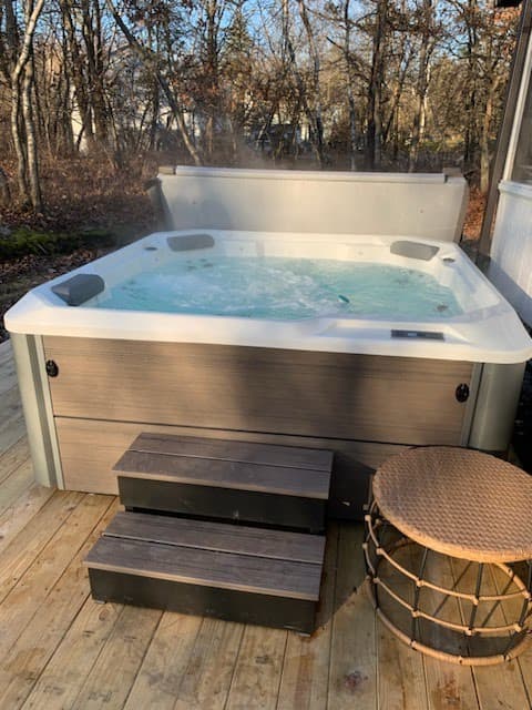 Beautiful hot tub only a few years old with waterfall feature!