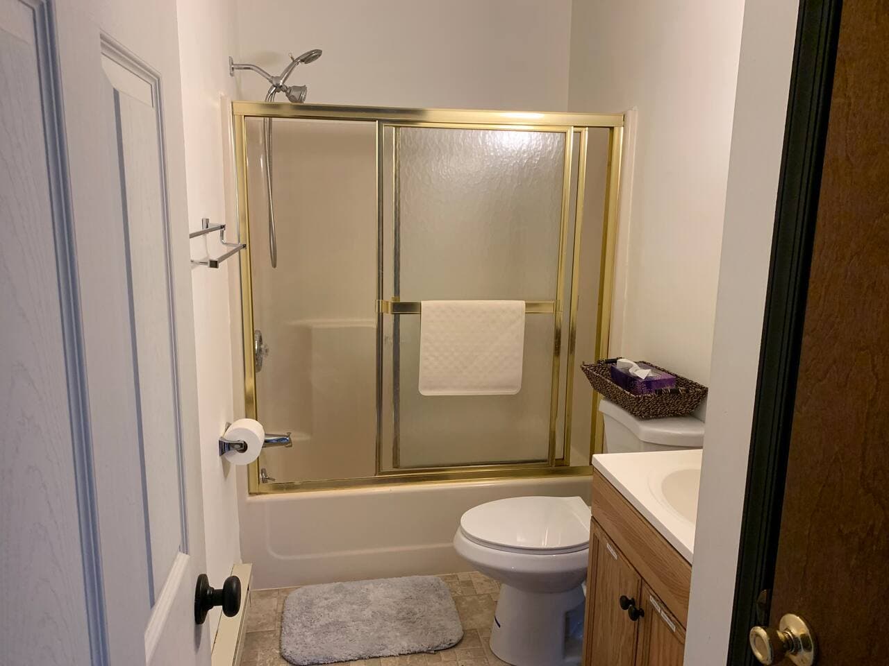 Large shower with doors and separate shower & water pic. 