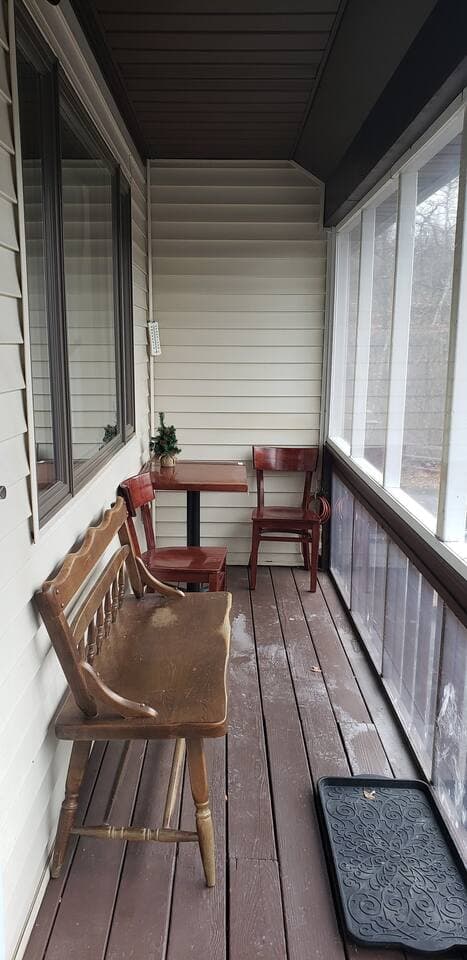 Front porch is enclosed and screened so the weather won't be a problem should you want breakfast alfresco at the bistro set. Spitting coffee. Or just sit on the old fashioned bench people watching while you digest.