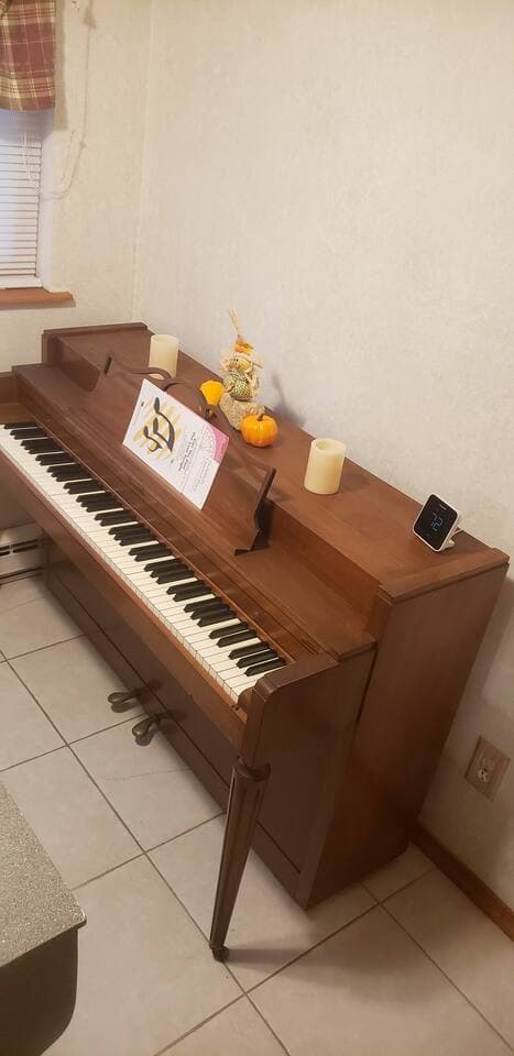 Even the piano cannot escape the holiday decors that consumes the house. Lol