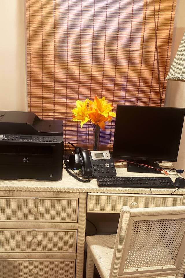 A dedicated workstation with computer monitor, keyboard, mouse, printer, business phone, Bluetooth headset, & laptop computer hookups. Everything you need for working remotely!