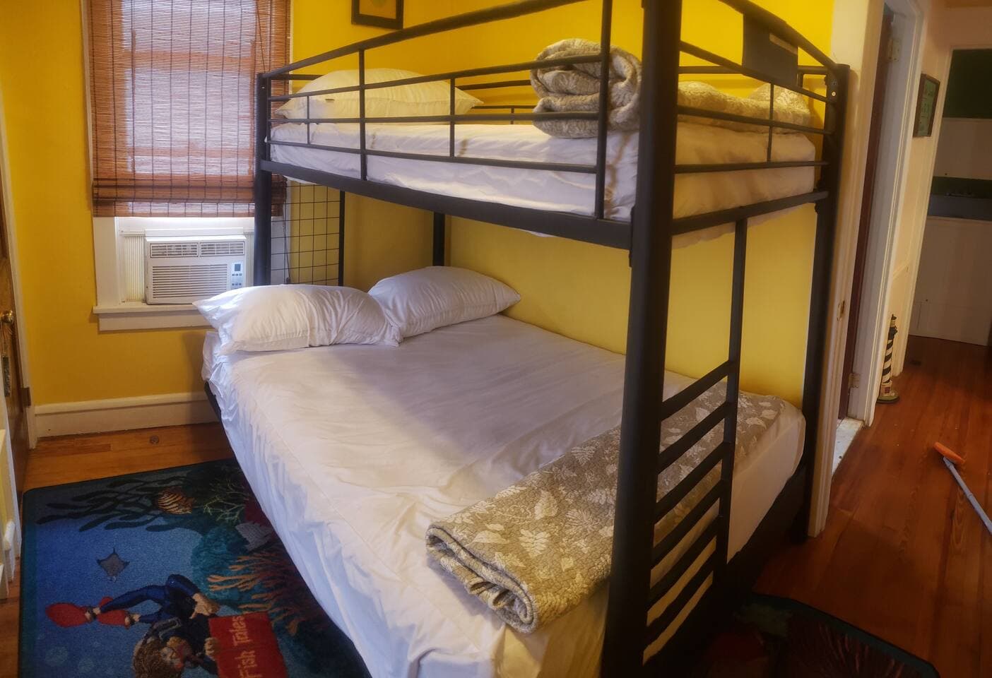 Top is a twin and bottom was converted to permanent full size plush bed. Max limit top bunk is 110lbs