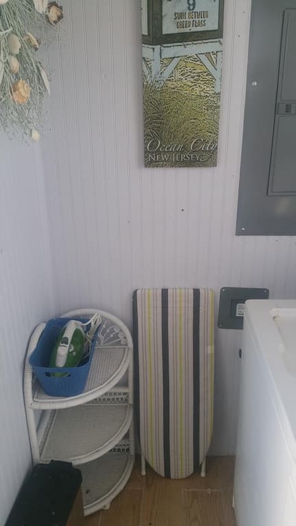 We provide an iron & ironing board. Clothes drying rack good for bathing suits & towels. DO NOT HANG STUFF ON RAILINGS. WE ARE FACING THE BAY IT WILL BLOW OFF INTO NEIGHBORS YARD!