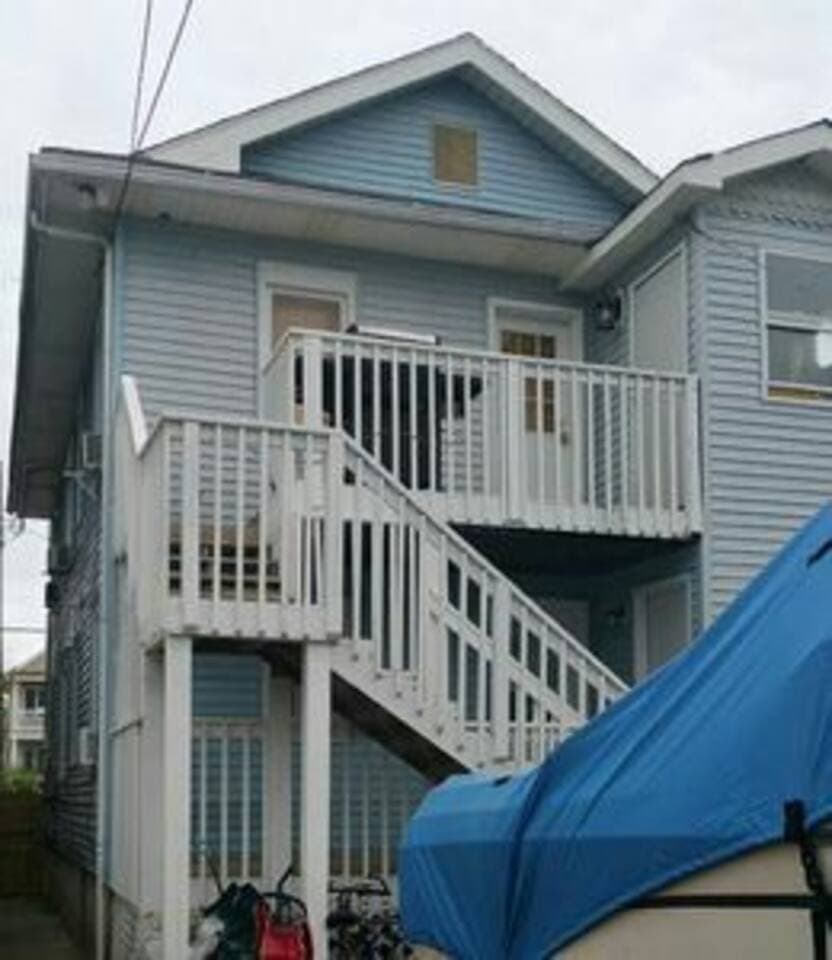 This is the back of house with the staircase entryway into the kitchen. Safety gate (not seen)! Perfect for those large bags and suitcases. Each stair has special metal anti slip strips. Bike rack perfect for parking your bikes (bikes not included) 