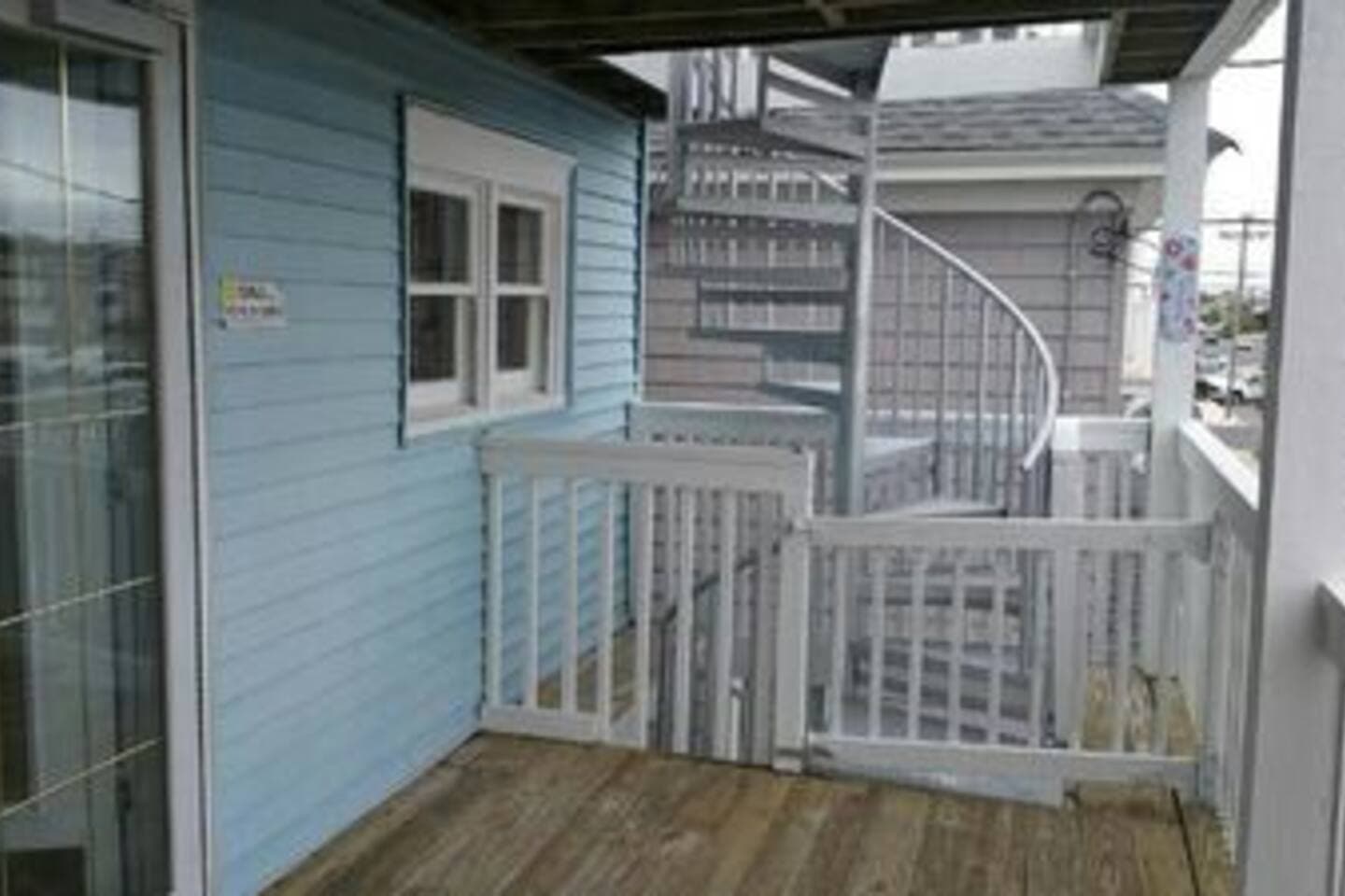 Spiral Staircase that leads to rooftop deck. Safety gates on the deck to prevent little runaways. Lol