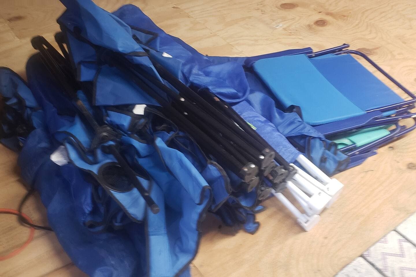Chair Pile!! We provide beach chairs for your use! We also have a couple of regular bi-foldable chairs. Can never have too many chairs. lol
