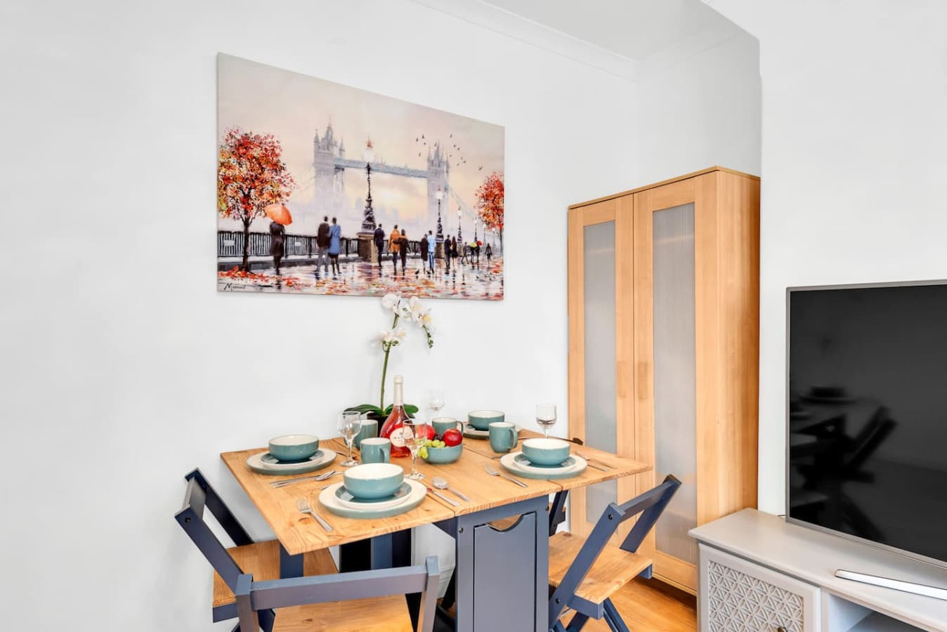 The dining room offers a charming view into the living room, creating a seamless flow between the two spaces.