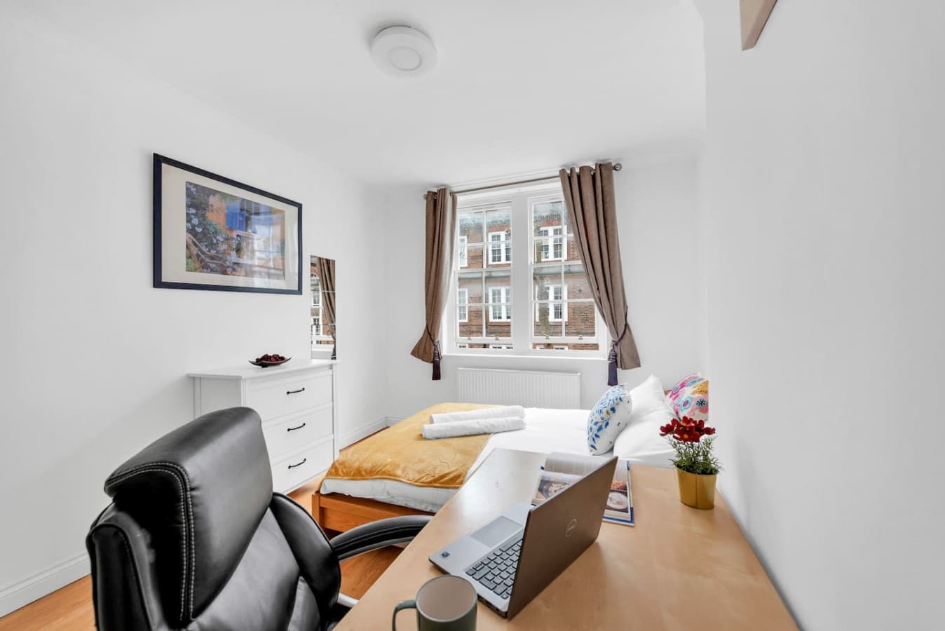 The desk and chair provided for guests to work from home are comfortable and functional.