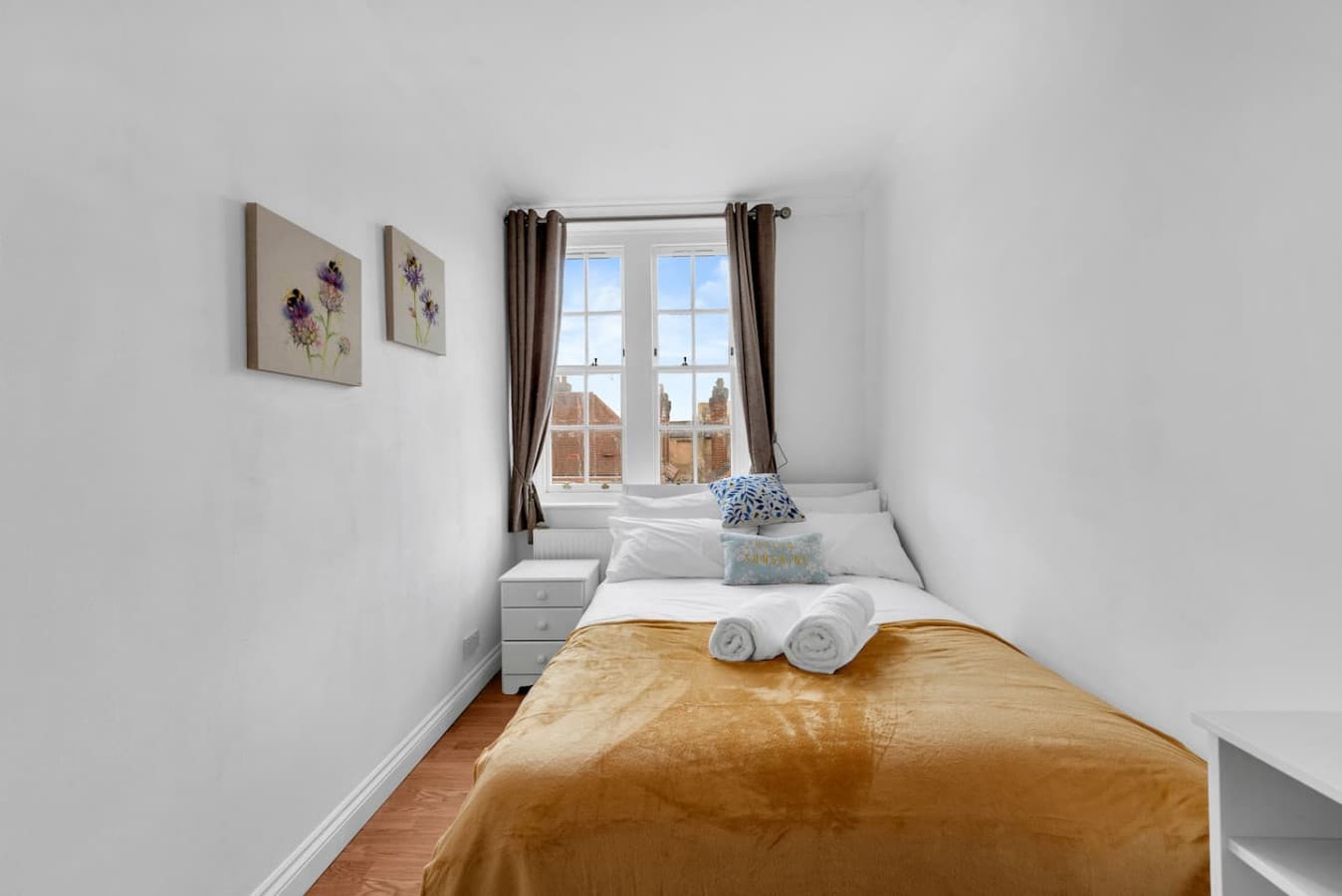 Each bedroom is tastefully furnished with a double bed, accompanied by high-quality bedding, to provide warmth and comfort.