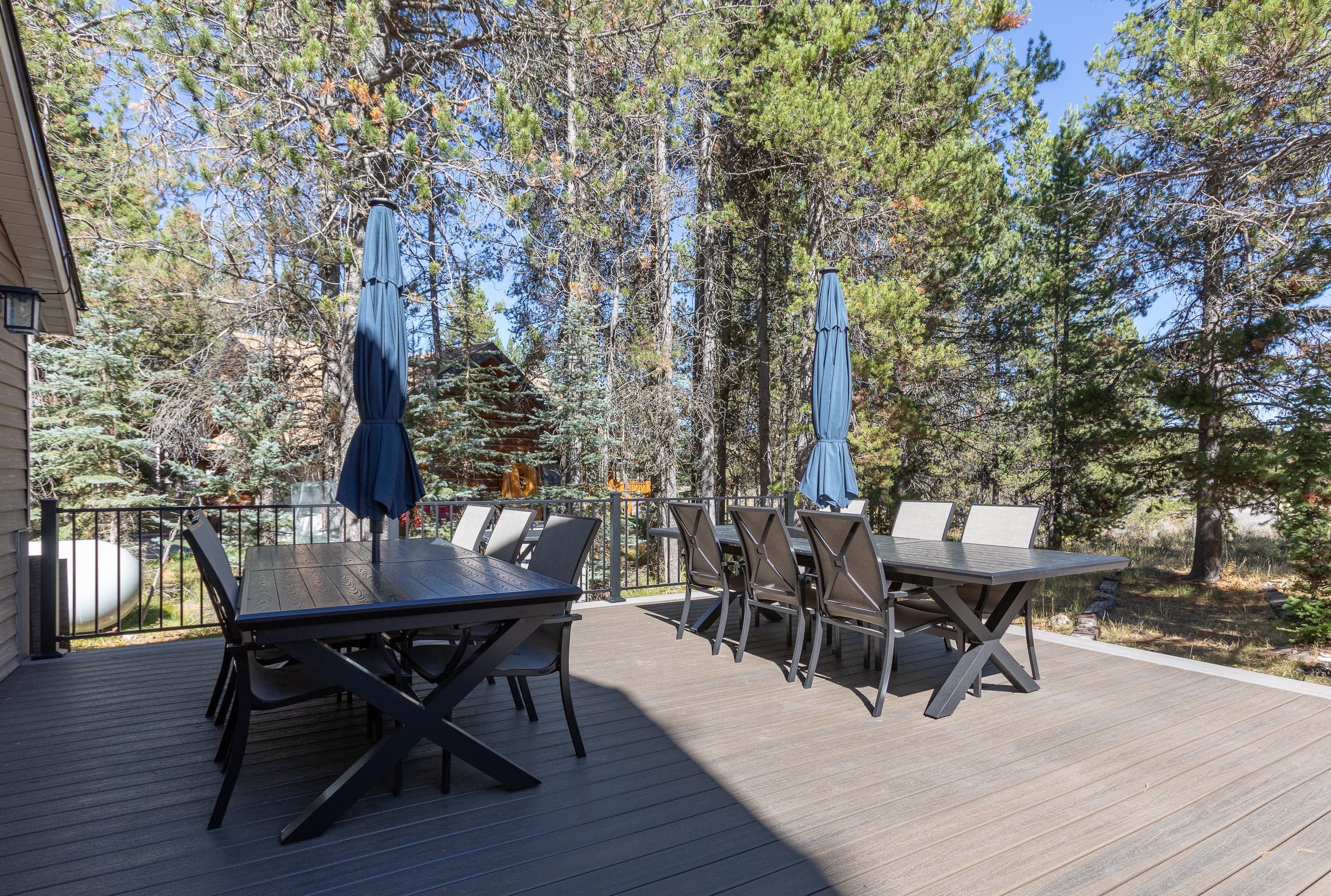 Patio tables offer extra dining space with shade umbrellas