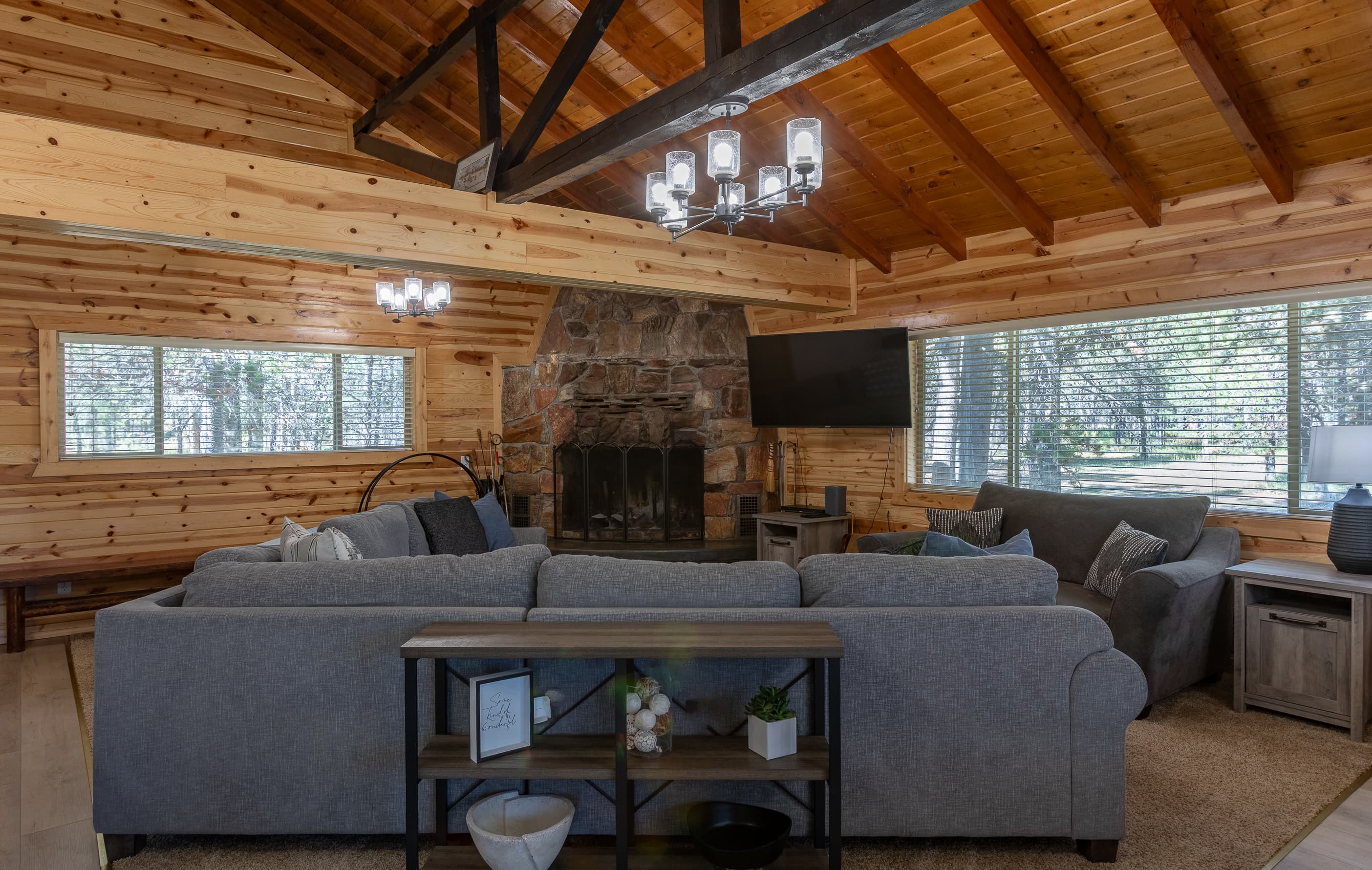 Living room with lots of room to gather to enjoy the fire or watch a movie