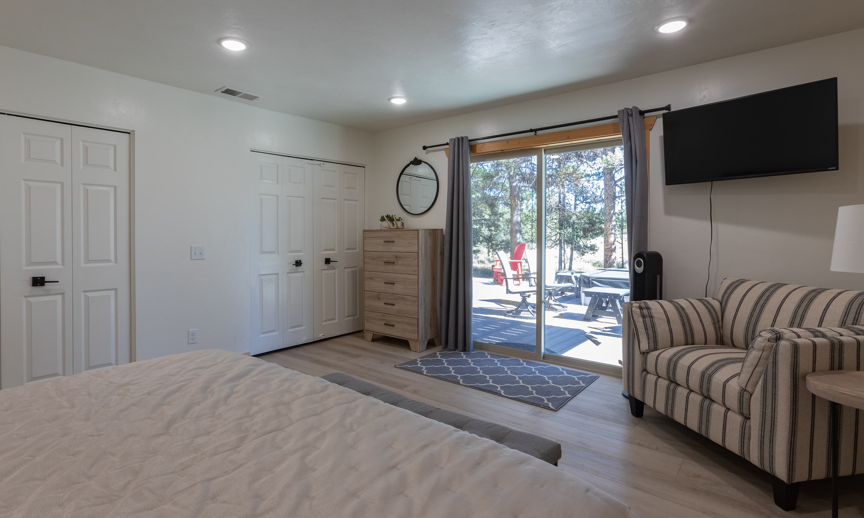 Relax in bedroom one with TV & plenty of clothing storage