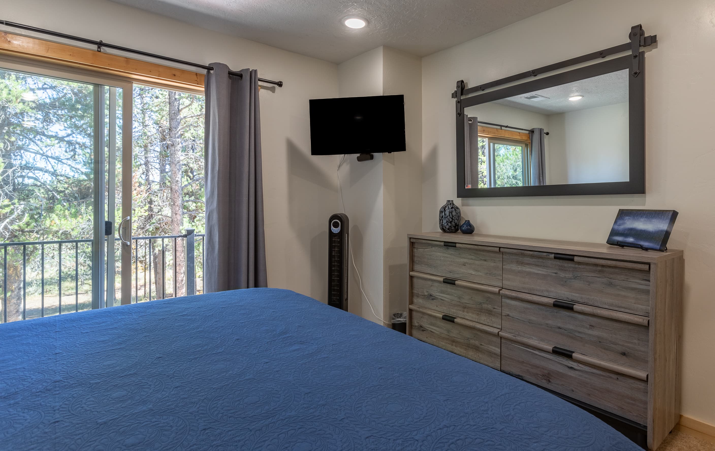Bedroom two has balcony access overlooking the back deck