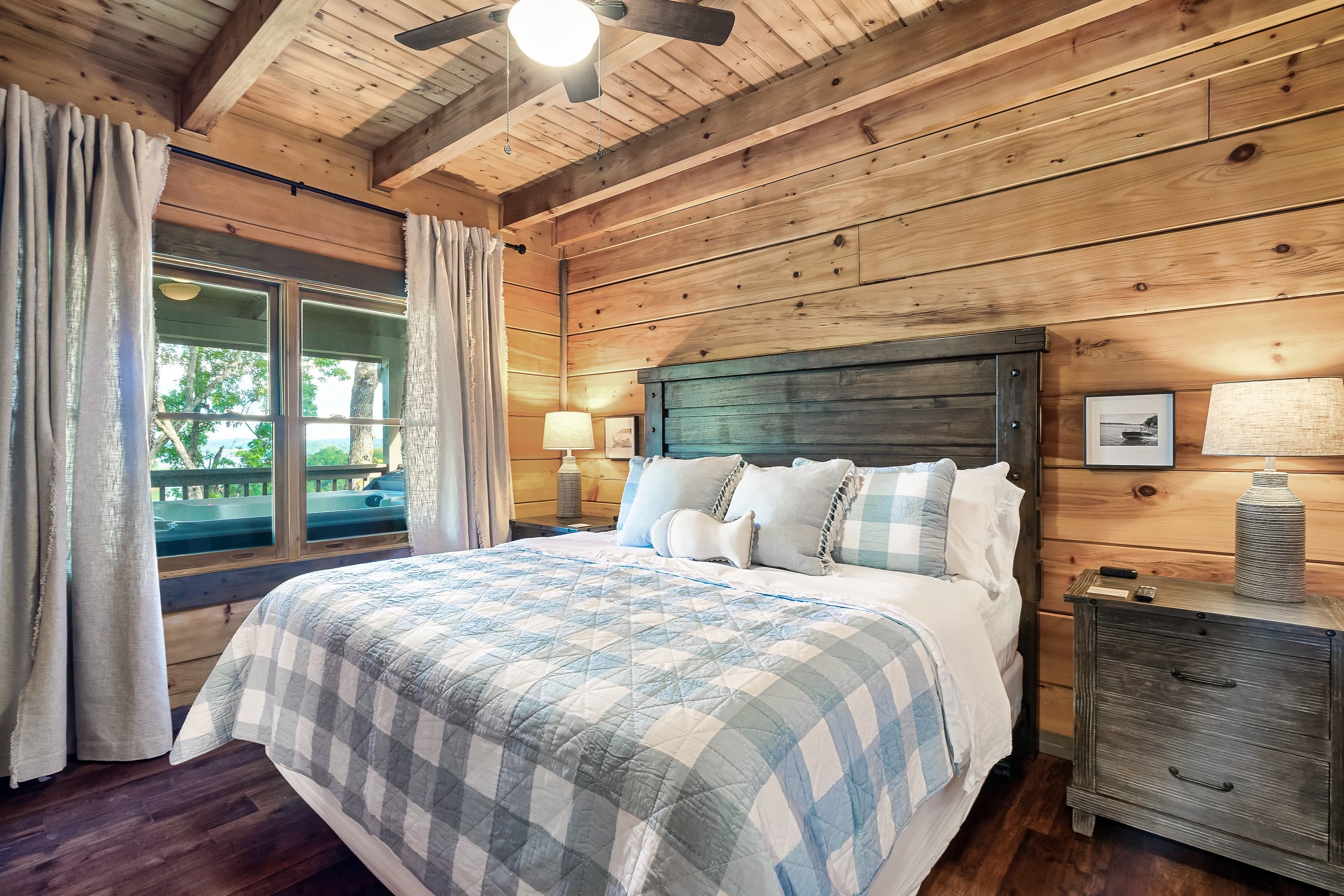 Wake up in a king bed overlooking Douglas Lake and English Mountain