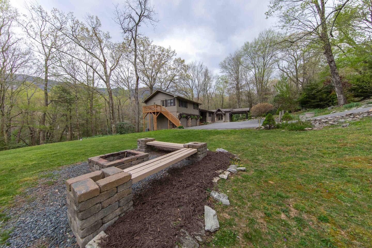 Fire pit and home view.  Home sits on 2.5 acres.