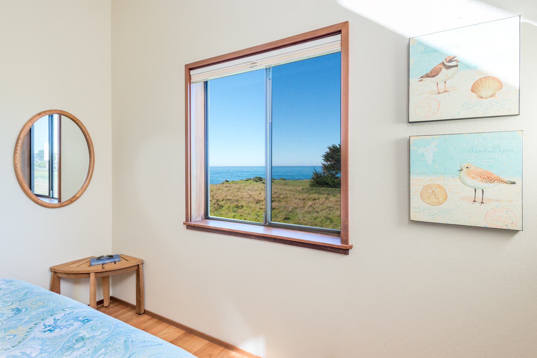 Guest room 2: Coastal charm with serene refinement: Wake to ocean views framed by soft coastal decor in this light-filled bedroom, where simplicity meets the elegance of seaside living.