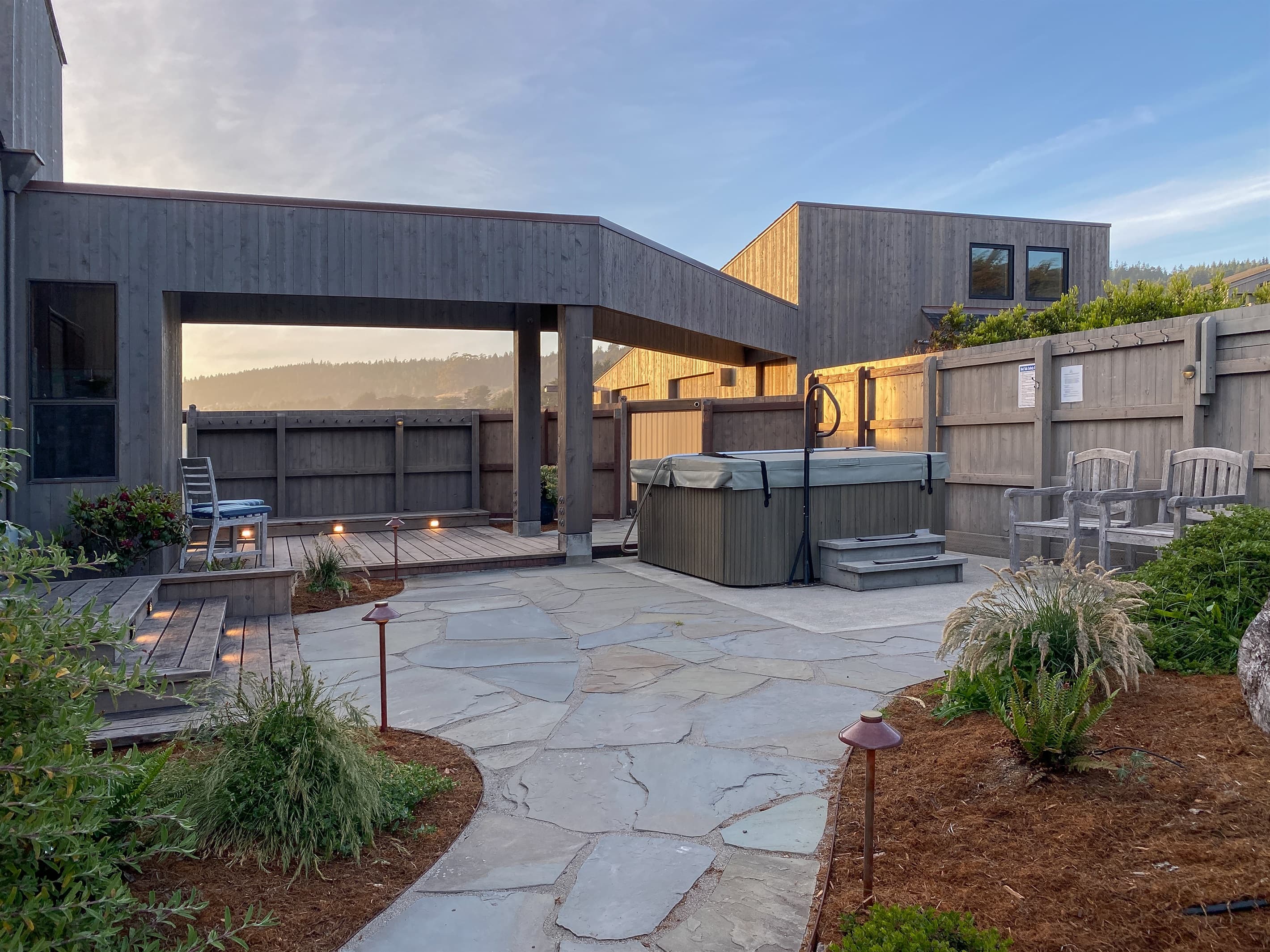 Courtyard at twilight: Downward lighting assures excellent viewing of clear nighttime skies and the Milky Way in our dark sky community. Hot tub awaits.