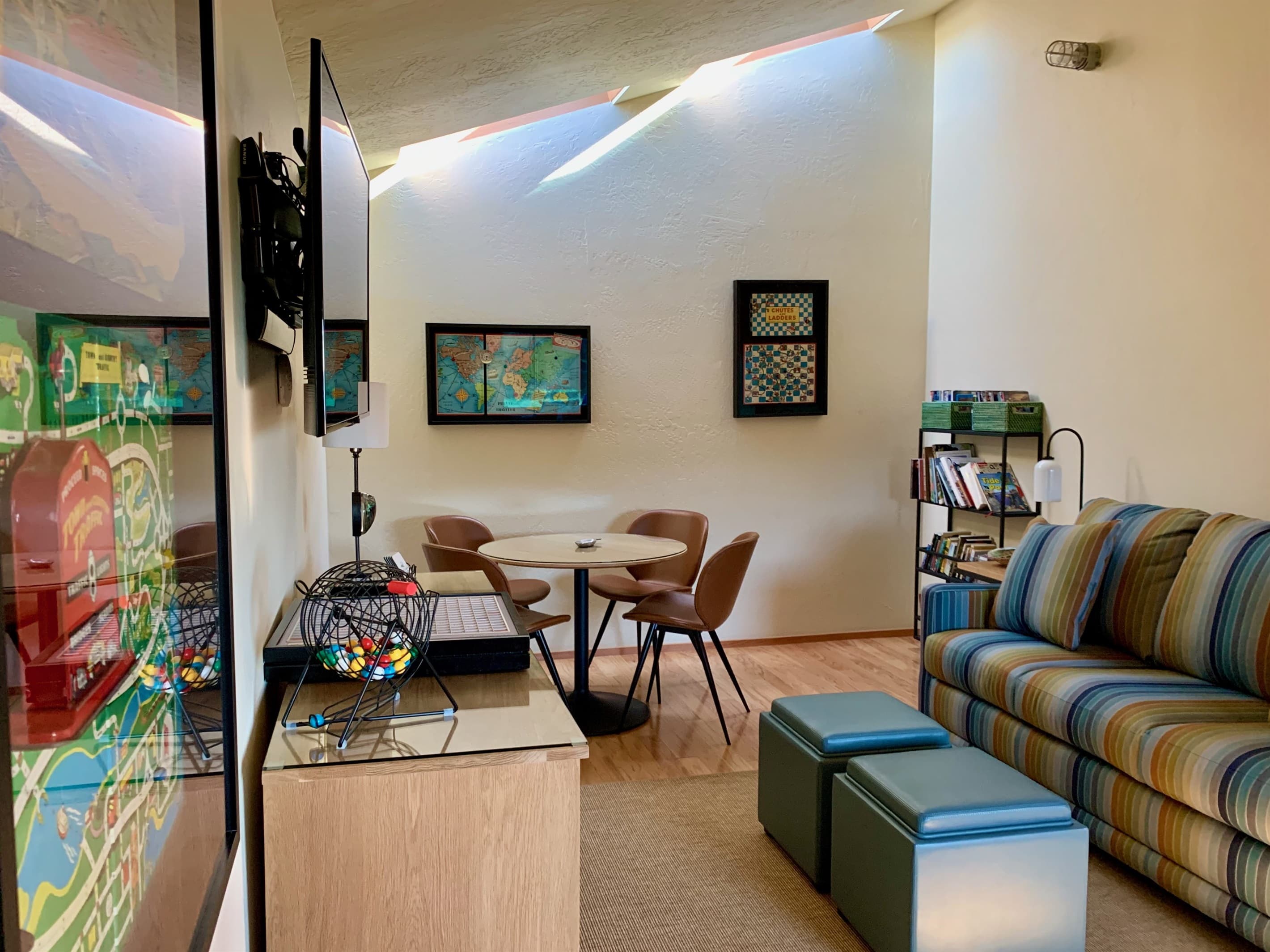 Vintage board game décor meets modern comfort.
Multi-purpose game room with a sofa sleeper, Enjoy puzzles, books, and ocean views, or use the space as a private office with strong WiFi.
