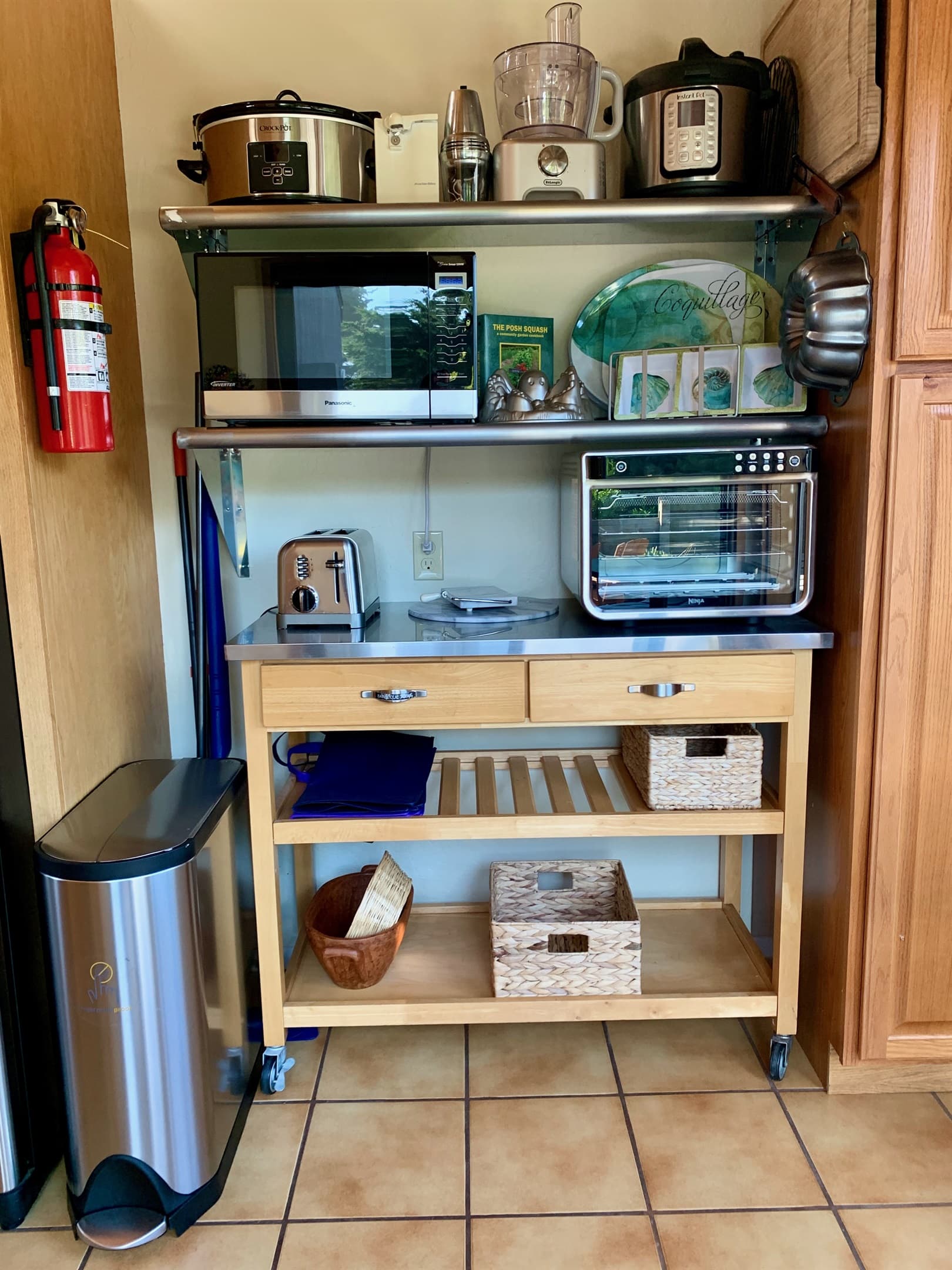 Kitchen Appliances and fire extinguisher plus fire mat.