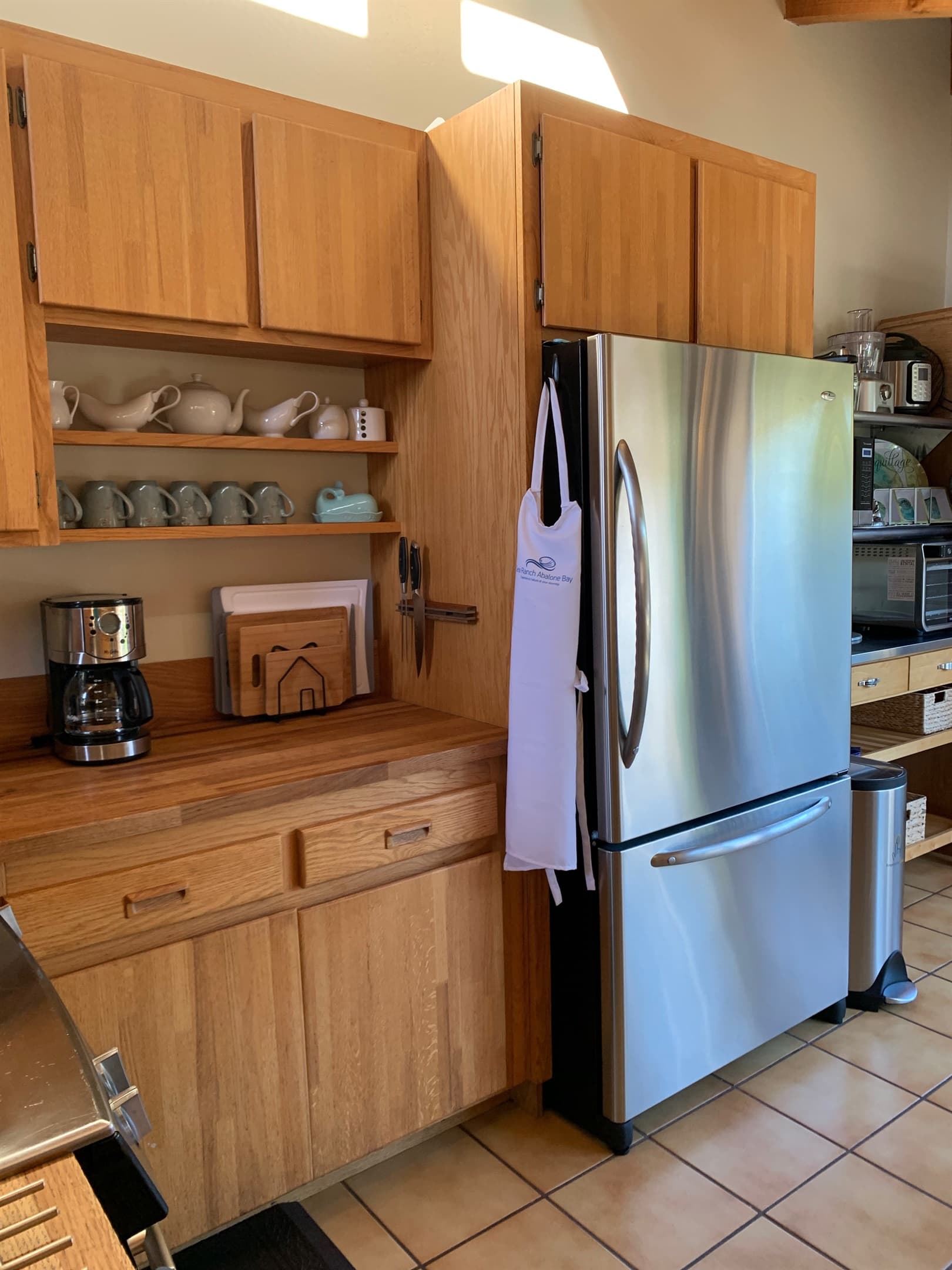 Kitchen counter, apron, coffee cups