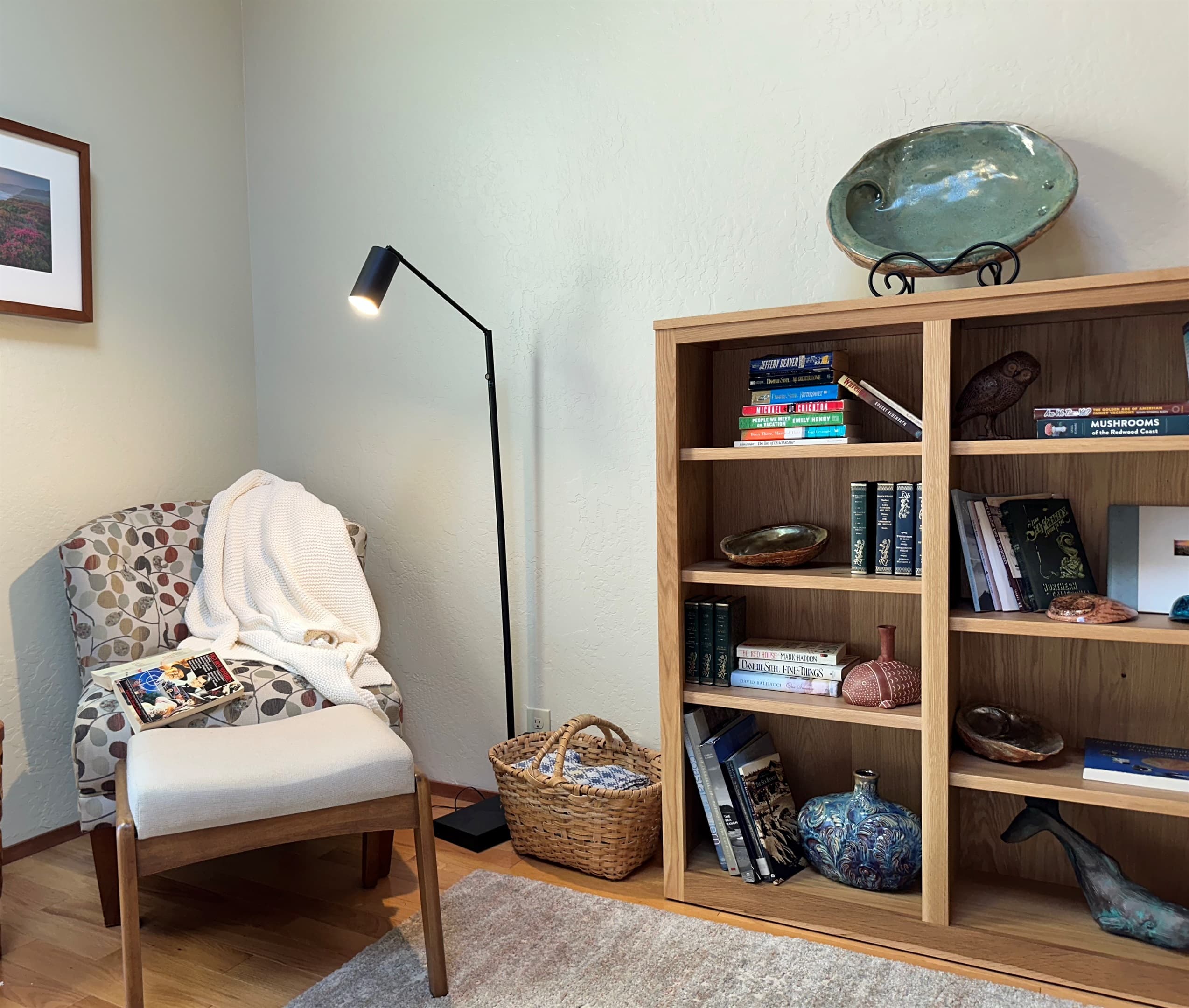 The library bookcase located in the principal bedroom. Others found in the living room and game room. Books include fiction/nonfiction for adults and children.