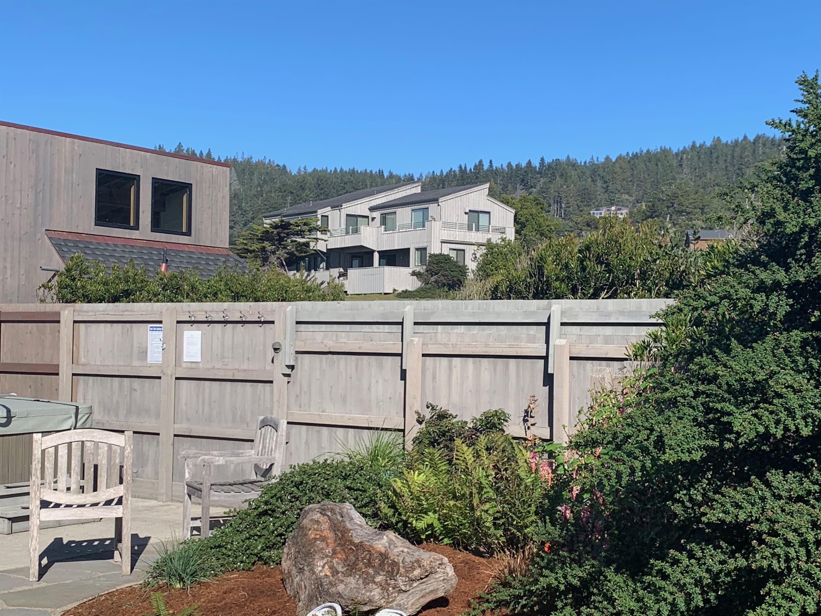 Neighborhood view  2b--garage at left. House across the street on hill