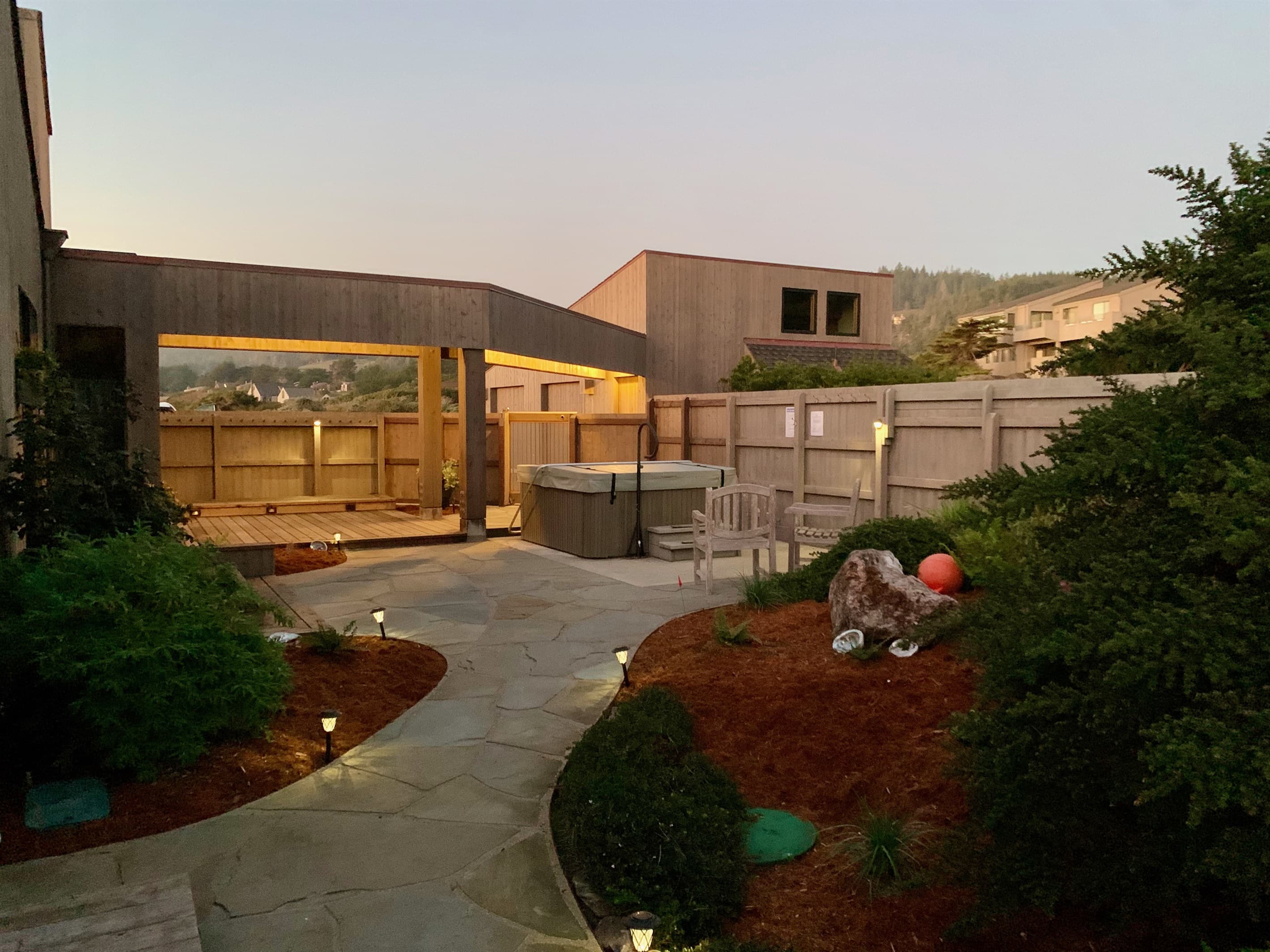 Lighted walkways in courtyard at twilight