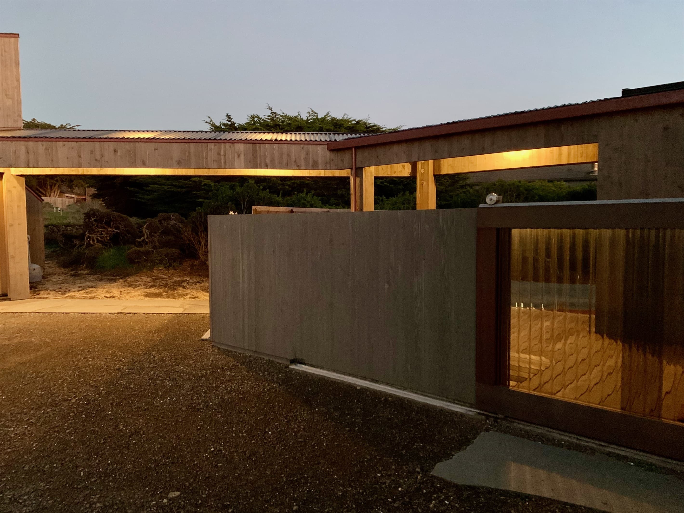 Lighted front gate at twilight