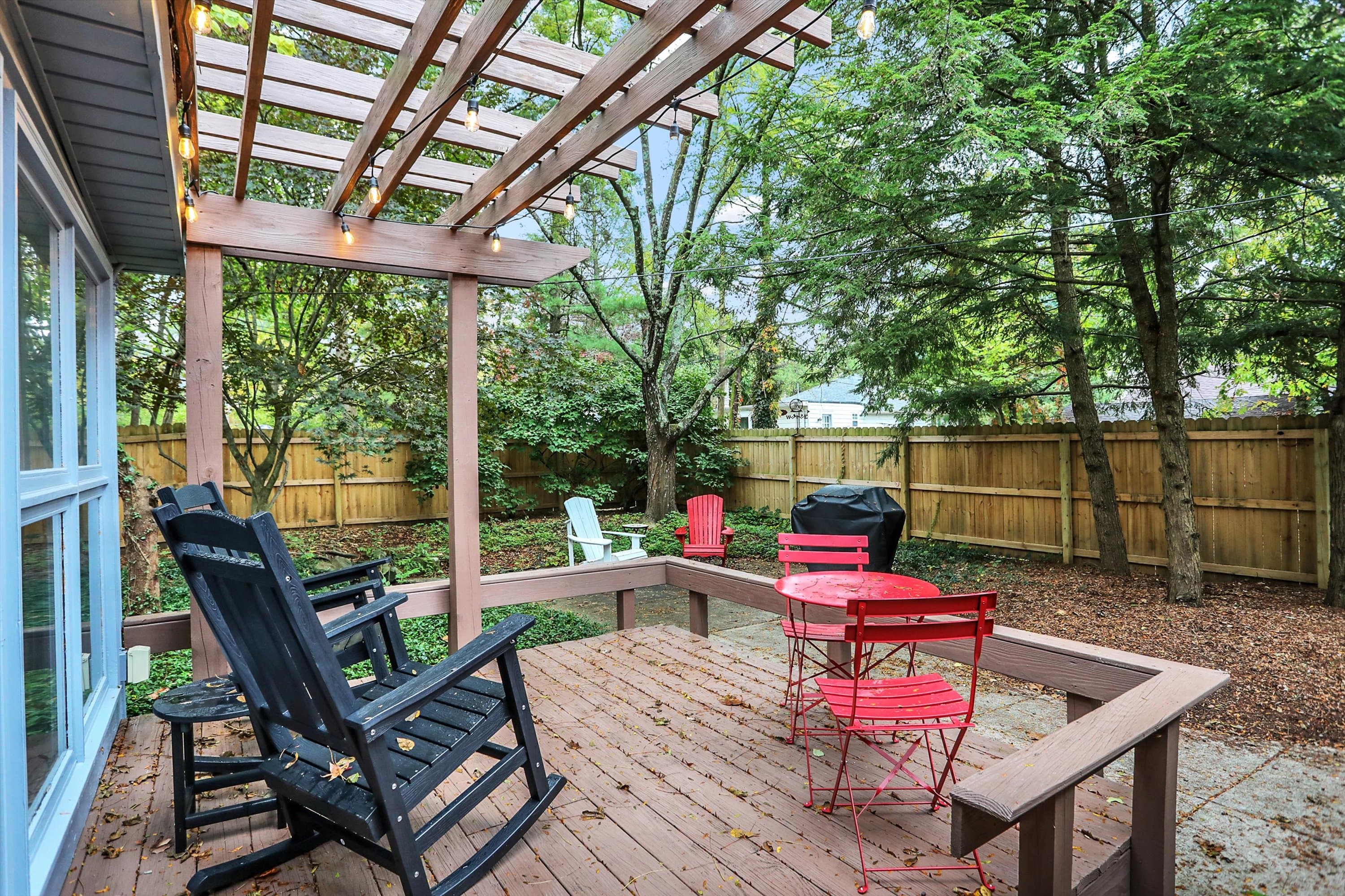 Back patio with a bistro set and plenty of seating