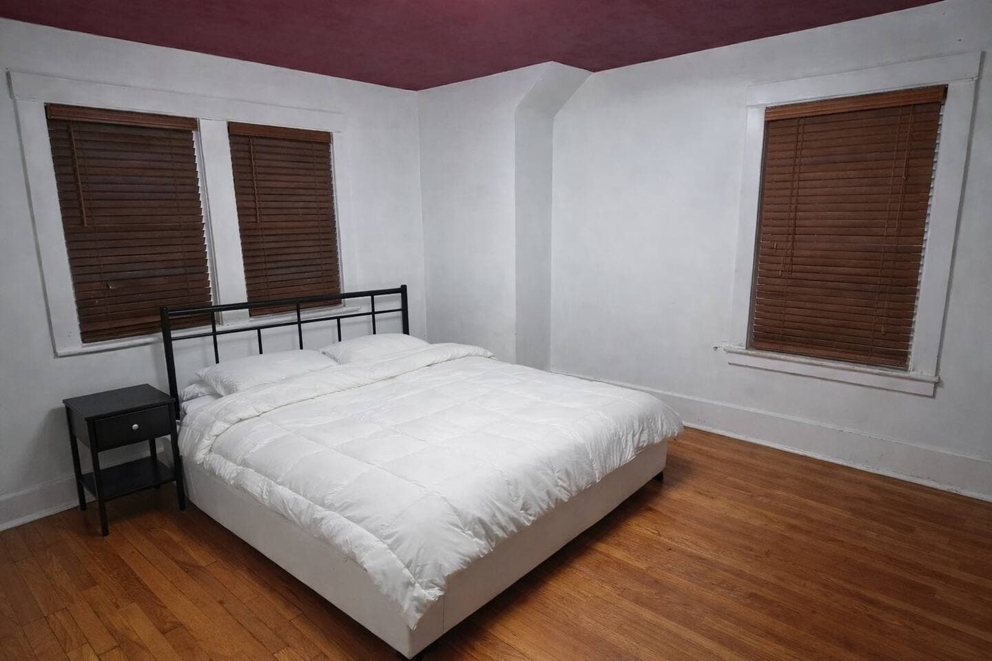 Relax for the evening in this peaceful bedroom featuring a comfortable queen sized bed and a 55" Smart TV.