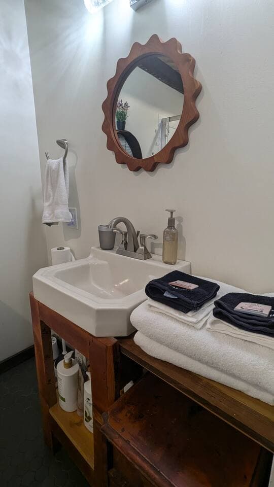 Stocked bathroom with toiletries and fluffy towels
