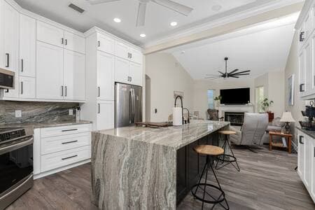 Gather around the elegant marble kitchen island. 