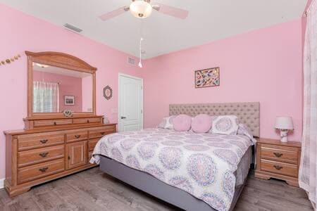 Colorful bedroom with fun details throughout and plenty of room to relax and unwind. 