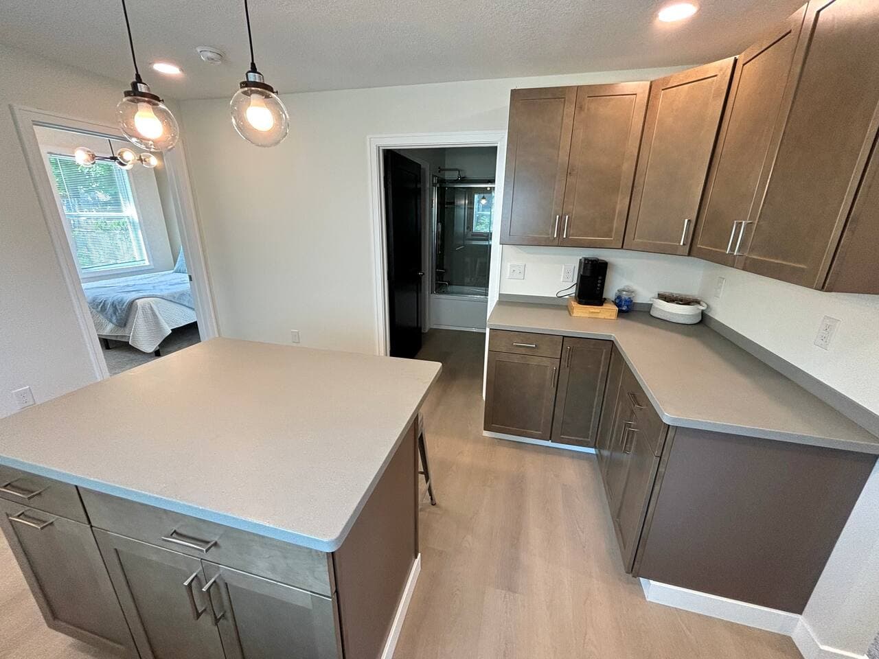 The kitchen has so much space to cook and eat in 