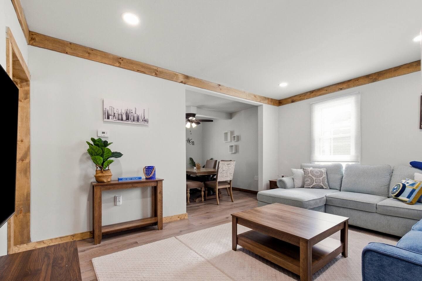 The living room leads into the cozy dining area. 
