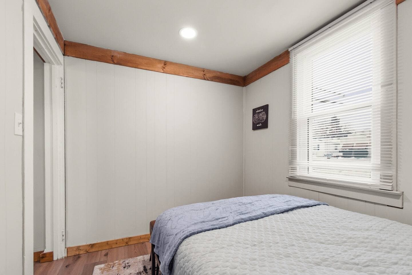 Relax in this cozy first floor bedroom next to the redecorated half bath. 