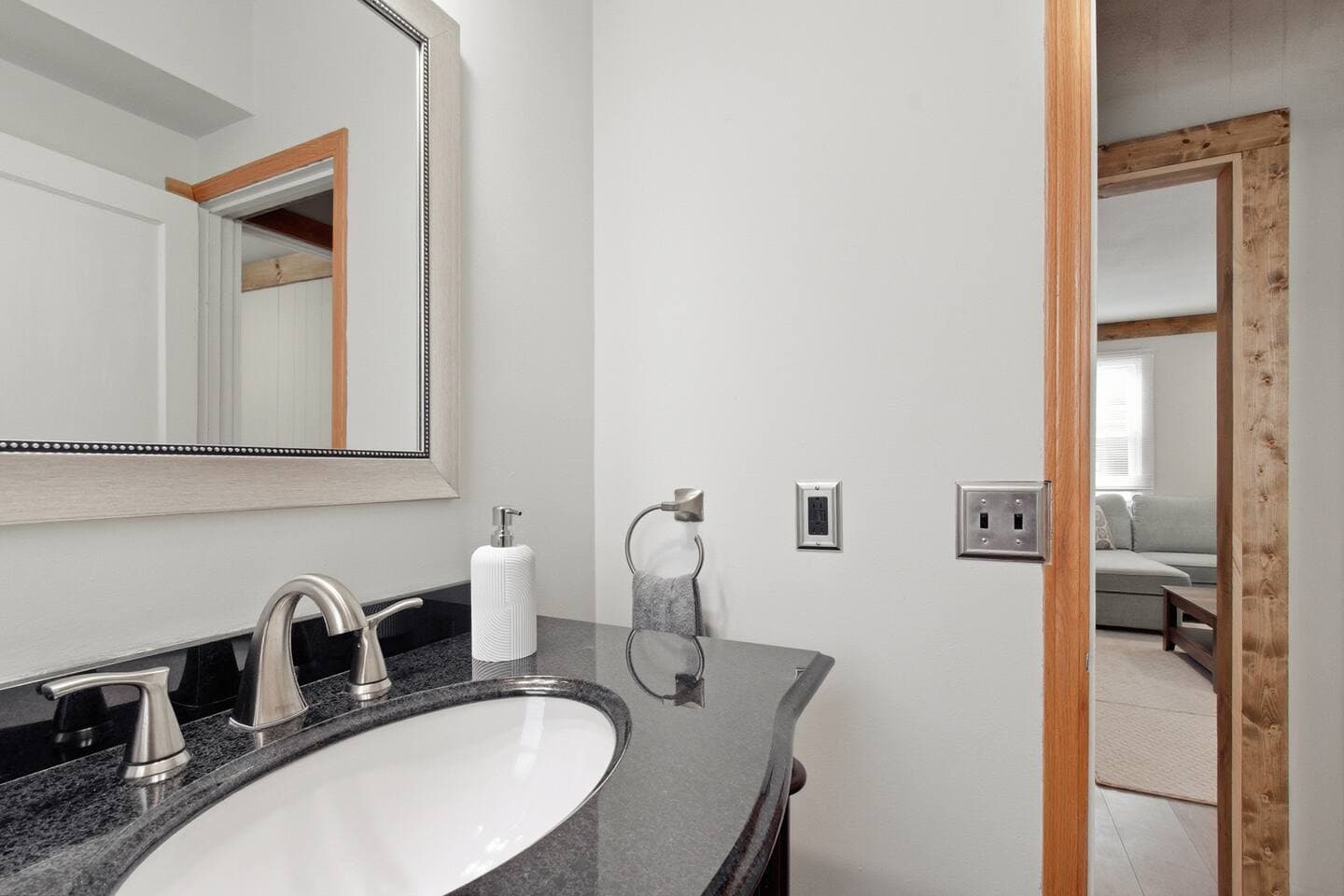 The half bathroom is stocked with toiletries and supplies and comfortable fluffy towels. 