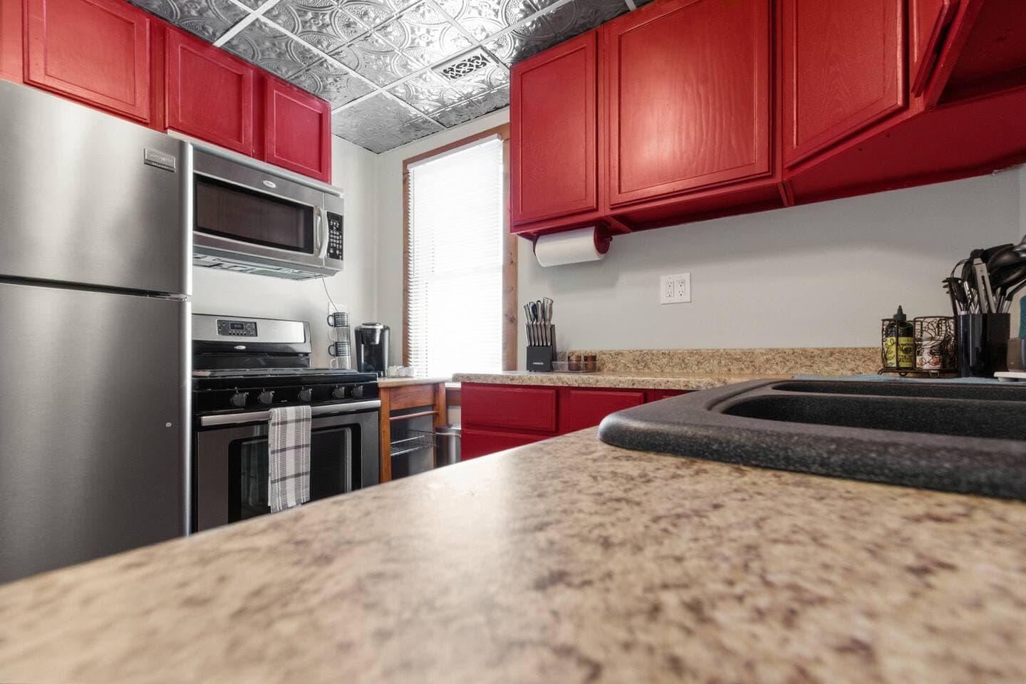 The renovated kitchen maintains the warm and vibrancy of the original farmhouse kitchen with many modern updates.  