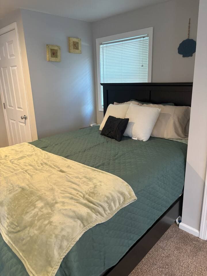 Rest easy in the comfortable queen-sized bed, complete with fresh linens and cozy bedding for a great night’s sleep.
