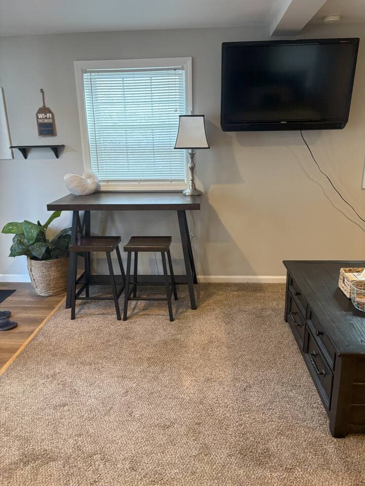 Catch up on emails or work during their stay, a dedicated workspace is available. The table provides plenty of room for your laptop and notes. It’s a quiet, practical spot to stay productive while away from home.