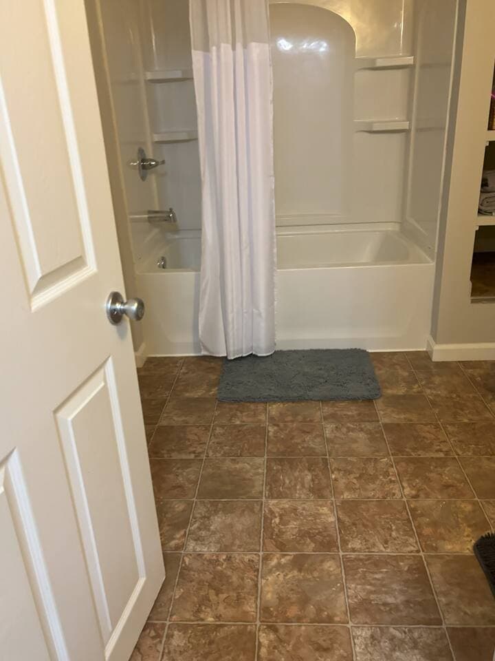 Refresh and recharge in the spacious bathroom, featuring a shower and tub combination that’s perfect for both quick rinses and long, relaxing soaks.
